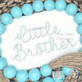 Preppy Little Brother Embroidery Design: The words Little Brother in light aqua script on white fabric