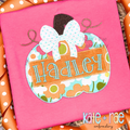 Girl's Pumpkin with Big Bow Zigzag Applique Embroidery Design: Floral pumpkin applique with a big white bow and the name Hadley on an orange name plate on a pink shirt