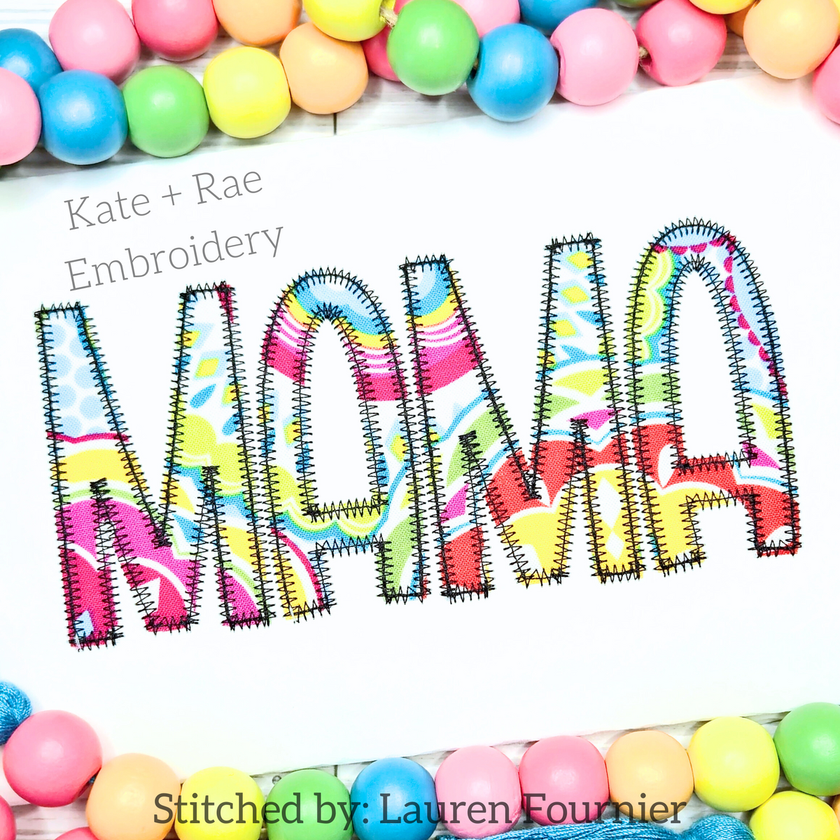 Kinley Zigzag Stitch Applique Embroidery Font: The word Mama in bright swirl print applique letters on white fabric