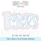 Tigers Double Applique Embroidery Design Bundle: Design preview of the word Tigers in light blue with a red bean stitch double outline, available in 5x7, 6x10, 7x12, 8x8, and 9x9