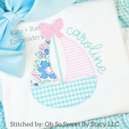 Girl's Scalloped Sailboat Zigzag Applique Embroidery Design: Scalloped sailboat with a pink bow and floral sails beside the name caroline in aqua script on a white shirt