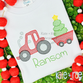 Tractor with Christmas Tree in Wagon Sketch Stitch Embroidery Design: Red tractor pulling a wagon with a Christmas tree above the name Ransom in green on a white shirt
