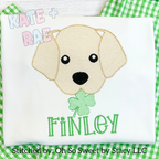 Boys St. Patrick's Day Puppy Dog Sketch Stitch Embroidery Design: Sketch stitch puppy holding a shamrock above the name Finley in green on a white shirt over green gingham