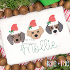 Santa Puppy Trio with Bows Sketch Stitch Embroidery Design: Three puppy faces wearing Santa hats with bows above the name Mollie in green script on a white shirt