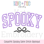Curved Spooky with Bow Satin Stitch Applique Embroidery Design: Design preview of SPOOKY in lavender curved satin applique letters with a black bow