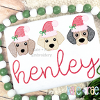 Santa Puppy Trio with Bows Sketch Stitch Embroidery Design: Three puppy faces wearing Santa hats with bows above the name henley in red script on a white shirt