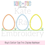 Boy's Easter Egg Trio Zigzag Applique Embroidery Design: Design preview of three zigzag applique Easter egg outlines in orange, blue, and yellow on grass