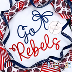Preppy Satin Stitch Embroidery Font: The words Go Rebels in navy and red preppy script with a navy bow on a white shirt