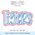 Tigers Zigzag Stitch Double Applique Embroidery Design: Design preview of the word Tigers in blue with a red zigzag double outline, available in 5x7, 6x10, 7x12, 8x8, and 9x9