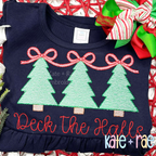 Girls Christmas Tree Trio with Connecting Bows Sketch Stitch Embroidery Design: Three mint Christmas trees linked by pink bows above the words Deck the Halls in red script on a navy shirt