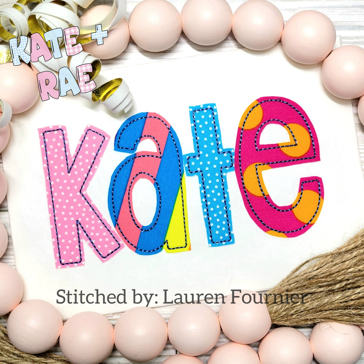 Cupcake Bean Stitch Applique Embroidery Font: The name Kate in pink, blue, and yellow patterned applique letters on a white shirt