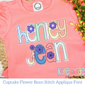 Cupcake Floral Bean Stitch Applique Embroidery Font: The name henley jean in pastel applique letters with purple flowers on a coral shirt