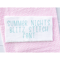 Summer Nights Blitz Stitch Embroidery Font: The words Summer Nights Blitz Stitch Font stitched in teal on white fabric over pink seersucker