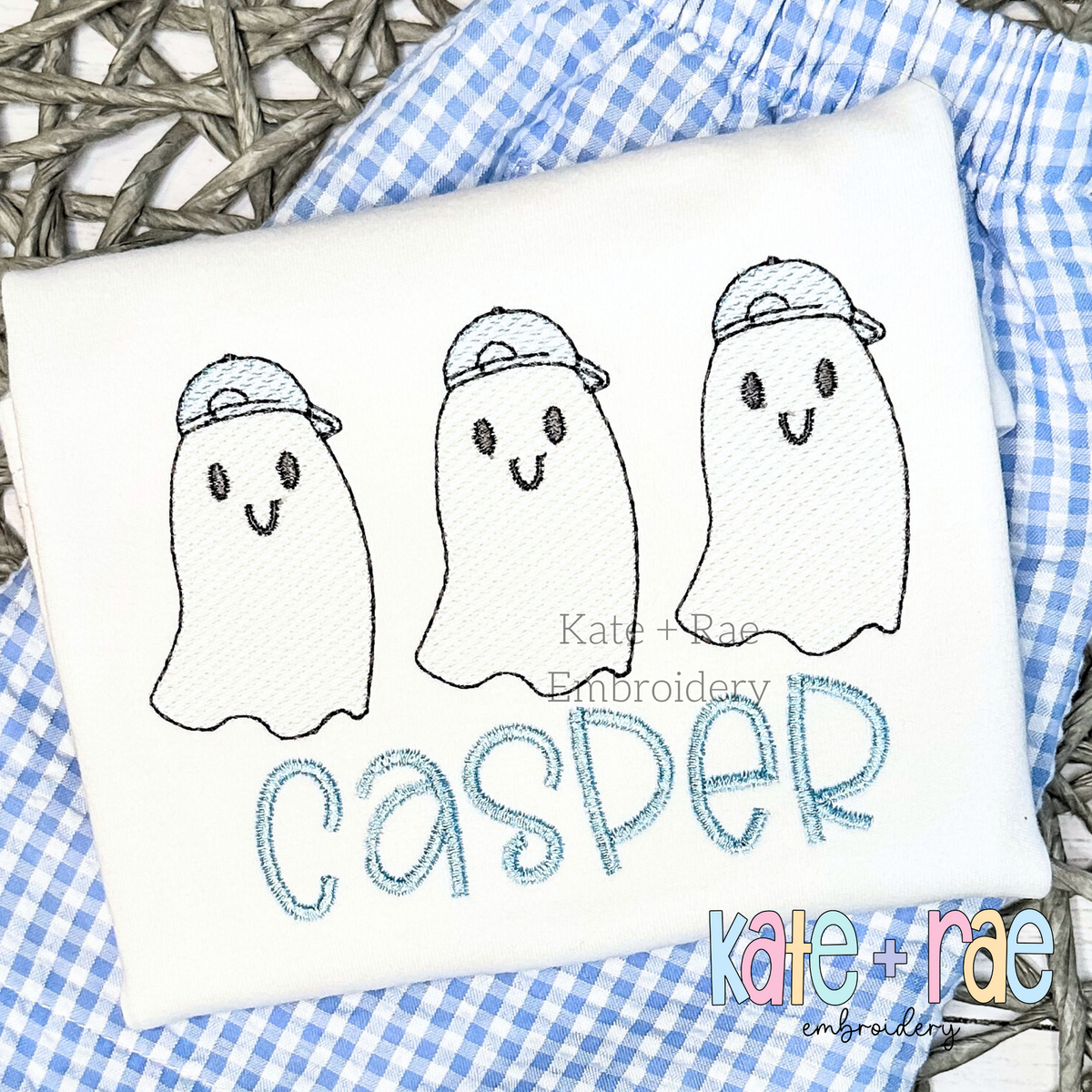 Boy's Ghost Trio Sketch Stitch Embroidery Design: Three sketch stitch ghosts wearing gray caps above the name Casper in blue on a white shirt