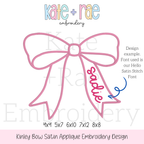 Kinley Bow Satin Stitch Applique Embroidery Design: Design preview of a pink satin bow with the name sadie on the tail in the Hello satin stitch font