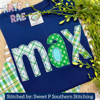 Cupcake Bean Stitch Applique Embroidery Font with Cutouts: The name max in green plaid and gingham applique letters on a navy shirt