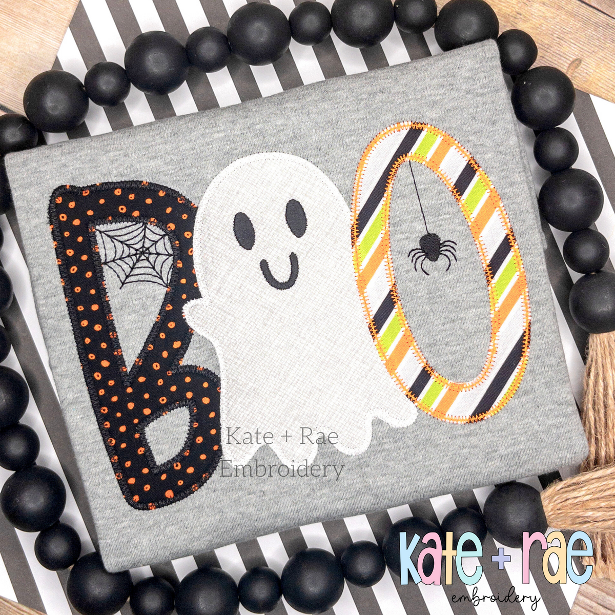 Boy's Boo Halloween Zigzag Applique Embroidery Design: The word BOO in black polka dot and striped applique with a white ghost on a gray shirt