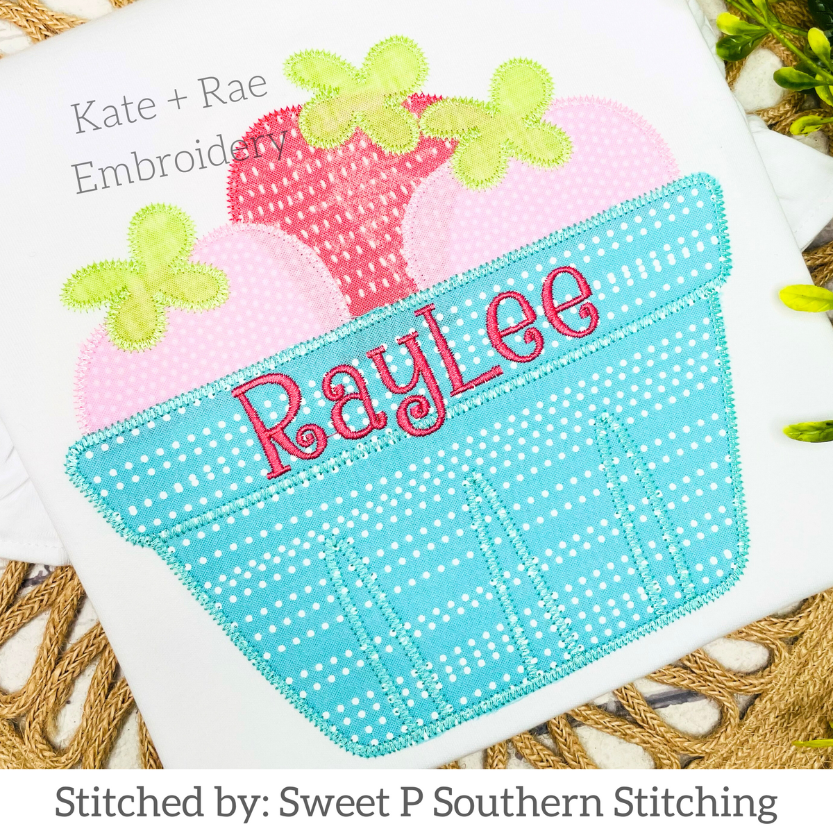 Strawberry Basket Zigzag Applique Embroidery Design: Strawberry basket applique with pink berries and the name RayLee in pink on a white shirt