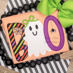 Girl's Boo Halloween Zigzag Applique Embroidery Design: The word BOO in striped and purple applique with a ghost wearing a green bow on an orange shirt