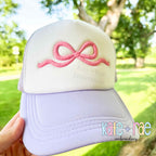 Flowy Bow 3D Puff Satin Stitch Embroidery Design: Close-up of a pink 3D puff flowy bow on a trucker hat