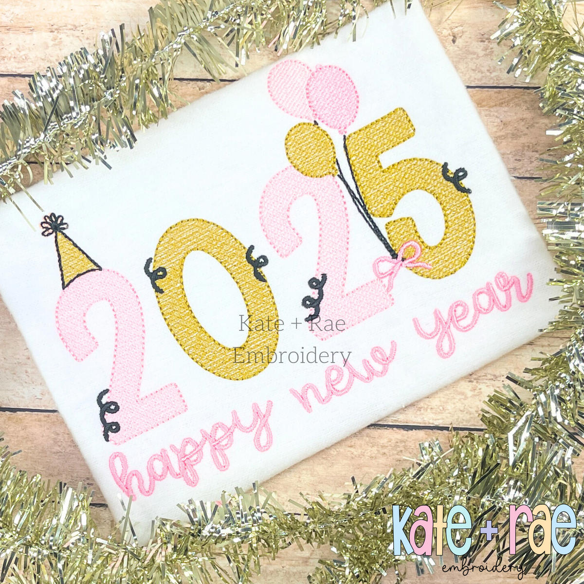 2025 New Year's Sketch Stitch Embroidery Design: 2025 in pink and gold sketch stitch numbers with balloons above happy new year in pink script on a white shirt