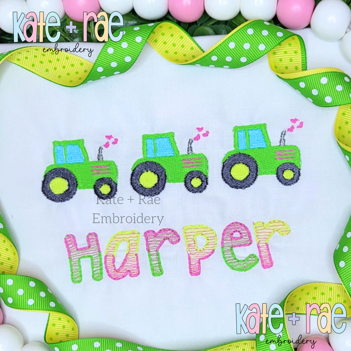 Heart Tractor Trio Fill Stitch Embroidery Design: Three green and blue tractors with pink hearts above the name Harper in pastel letters on a white shirt