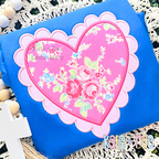 Scalloped Double Heart Satin Stitch Applique Embroidery Design: Pink floral heart inside a lavender scalloped heart applique on a blue shirt