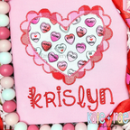 Scalloped Double Heart Zigzag Stitch Applique Embroidery Design: Conversation heart print applique inside a red scalloped heart above the name krislyn on a pink shirt