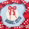 Baseball/ Softball with Merritt Bow Satin Stitch Embroidery Design: Baseball applique with a red polka dot bow above the words baseball sister in navy on a light blue shirt