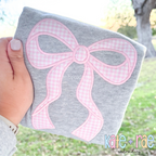 Merritt Bow Satin Stitch Applique Embroidery Design: Large pink gingham Merritt bow applique on a gray sweatshirt