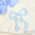 Merritt Bow Zigzag Stitch Applique Embroidery Design: Light blue floral Merritt bow applique on a cream sweatshirt