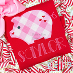 Heart Piggy Zigzag Stitch Applique Embroidery Design: Pink gingham pig applique with hearts above the name SAYLOR on a red shirt