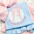 Baseball/ Softball with Merritt Bow Zigzag Stitch Embroidery Design: Baseball applique with a pink gingham bow above the words baseball sister in pink on a light blue shirt