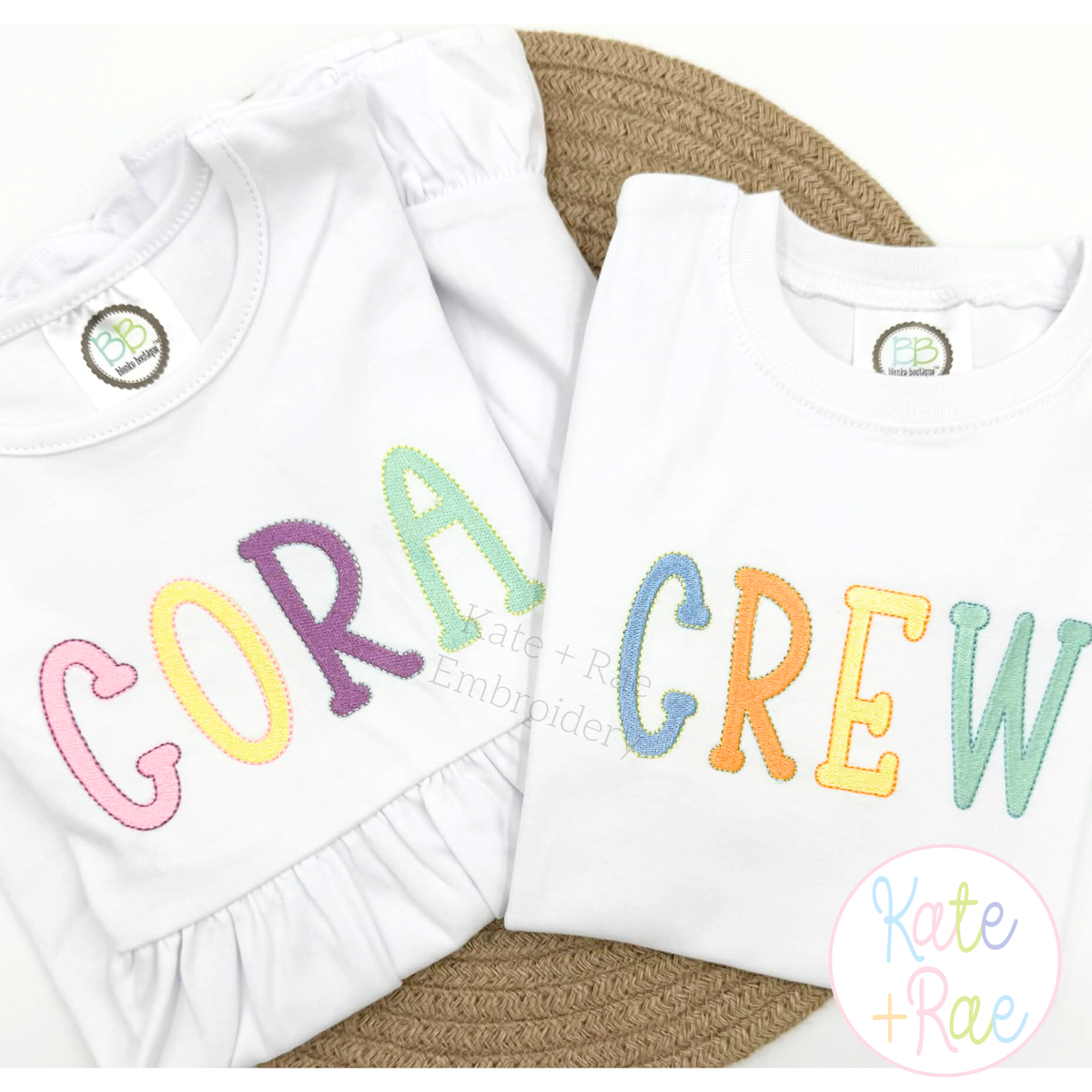 Jellybean Fill Stitch with Bean Border Machine Embroidery Font: The names CORA and CREW in pastel Jellybean fill stitch letters on white shirts