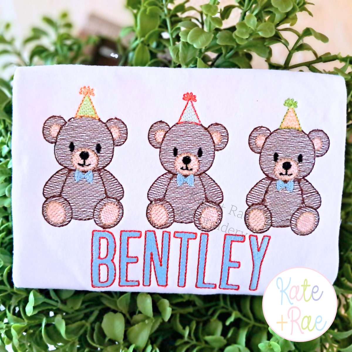 Boy's Teddy Bear Birthday Trio Sketch Stitch Embroidery Design: Three sketch teddy bears with party hats above BENTLEY in blue on a white shirt