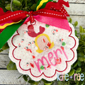 ITH Scalloped Circle Bag Tag Bean Stitch Applique Embroidery Design: Scalloped circle bag tag with a confetti shaker window and a name in pink tied with red and green ribbons