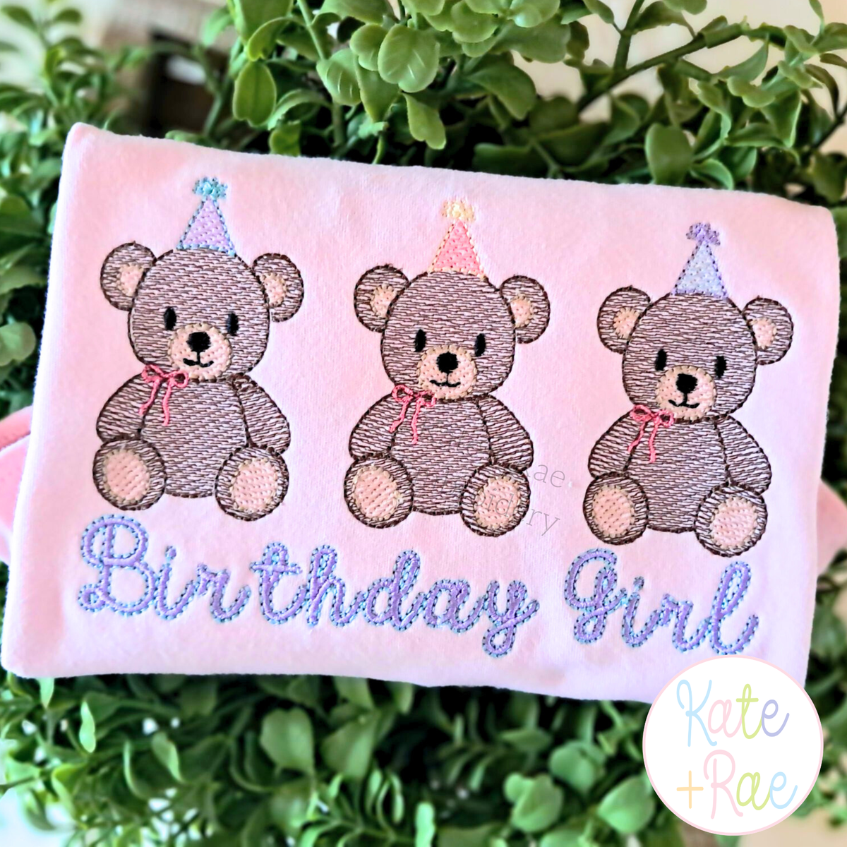 Girl's Teddy Bear Birthday Trio Sketch Stitch Embroidery Design: Three sketch teddy bears with party hats above Birthday Girl in lavender script on a pink shirt
