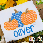 Boy's Fall Pumpkin Trio with Bows Zigzag Stitch Applique Machine Embroidery Design: Orange and blue gingham pumpkin appliques above the name Oliver in blue on a white shirt