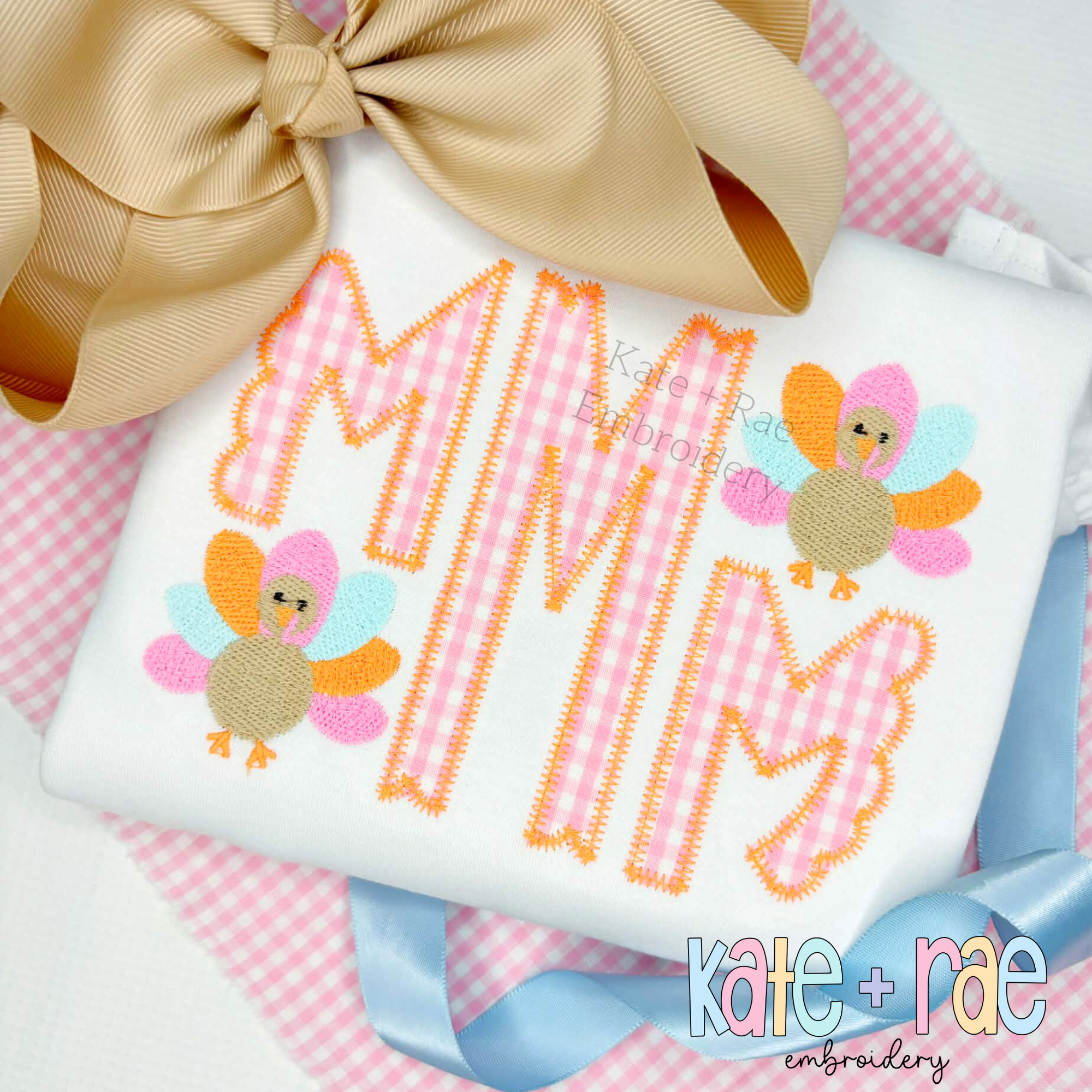Thanksgiving Turkey Mini Fill Stitch Machine Embroidery Design: Pink gingham letter M applique with two mini fill turkeys on a white shirt