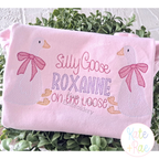 Girl Goose Sketch Stitch with Bow Embroidery Design: Two sketch geese with pink bows around Silly Goose ROXANNE on the loose on a pink shirt