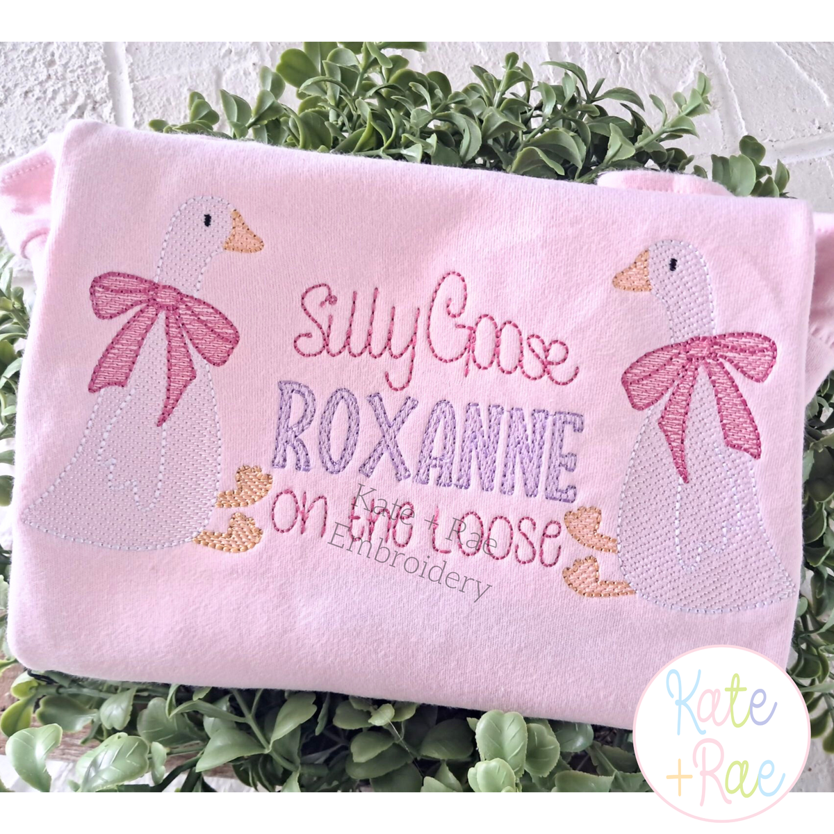 Girl Goose Sketch Stitch with Bow Embroidery Design: Two sketch geese with pink bows around Silly Goose ROXANNE on the loose on a pink shirt