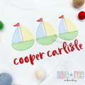 Sailboat Trio Sketch Stitch Embroidery Design: Three blue, yellow, and green sketch stitch sailboats above the name cooper carlisle in red script