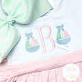Girl's Sailboat with Bow Mini Fill Stitch Embroidery Design: Two mini sailboats with bows beside a pink letter B on a mint and pink striped outfit