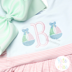 Girl's Sailboat with Bow Mini Fill Stitch Embroidery Design: Two mini sailboats with bows beside a pink letter B on a mint and pink striped outfit