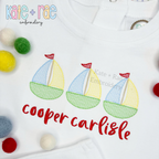 Sailboat Trio Sketch Stitch Embroidery Design: Close-up of three pastel sketch sailboats with red flags above the name cooper carlisle