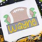 Football with Name Plate Sketch Stitch Applique Embroidery Design: Sketch stitch football above a gray name plate reading Wayne in yellow on a white shirt