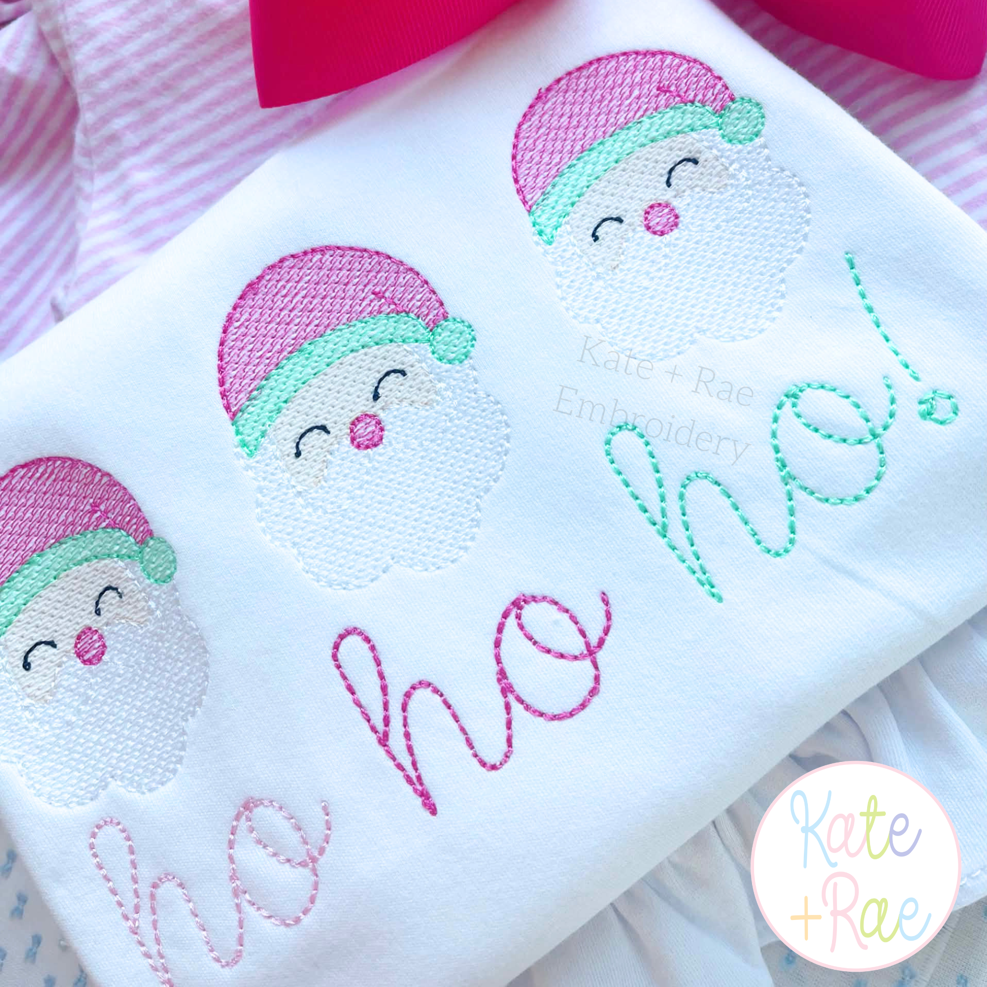 Santa Claus Mini Sketch Stitch Embroidery Design: Three pastel sketch Santa faces above ho ho ho in pink and mint script on a white shirt