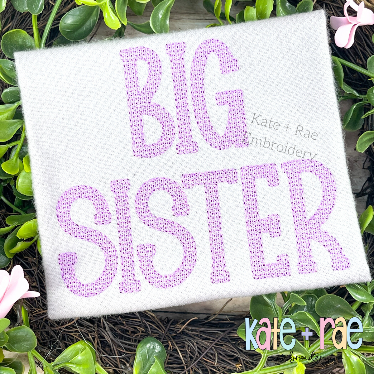 Gracie Faux French Knot Motif Fill Stitch Embroidery Font: BIG SISTER in lavender faux French knot block letters on a white shirt