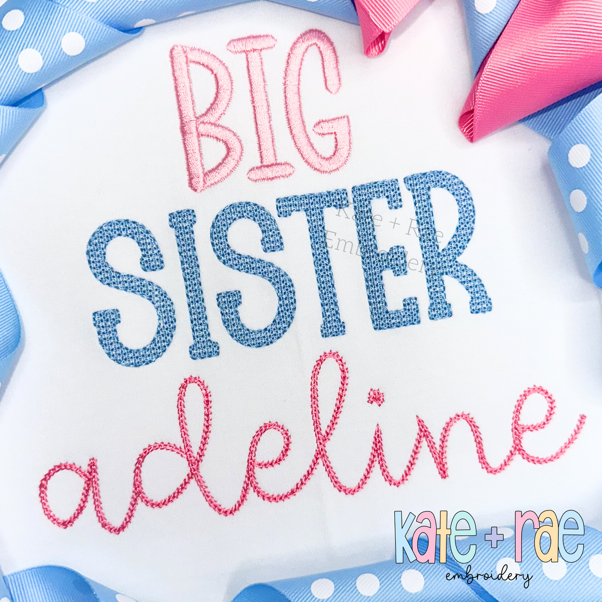 Gracie Faux French Knot Motif Fill Stitch Embroidery Font: BIG SISTER in pink and blue faux knot letters above the name adeline in pink script on a white shirt