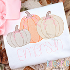 Girl's Fall Pumpkin Trio with Bows Sketch Stitch Machine Embroidery Design: Three pastel sketch pumpkins with pink bows above the name Emersyn in pink on a white shirt